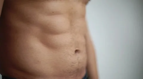 Embossed torso turns into a paunchy belly man loses weight and gets fat Stock Footage 44392323