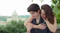 embracing couple laughing and joking - saint peter in background HD Footage