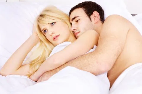 Embracing her in bed Stock Photos