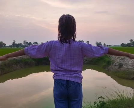 Embracing the Sunset over Tranquil Fields Stock Photos