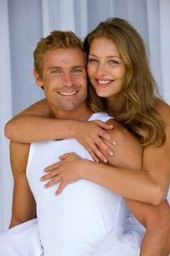 Embracing young couple Stock Photos