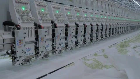 Embro embroidery machine is creating decorative textile pattern on the fabric Stock Footage 347248473