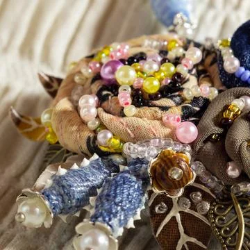 Embroidered flowers. Handiwork. Stock Photos