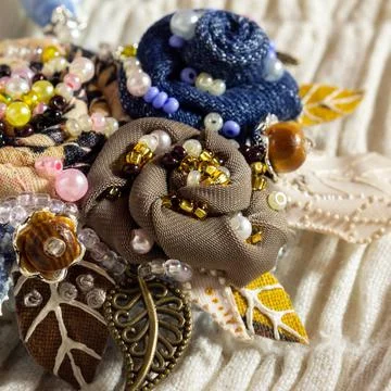 Embroidered flowers. Handiwork. Stock Photos