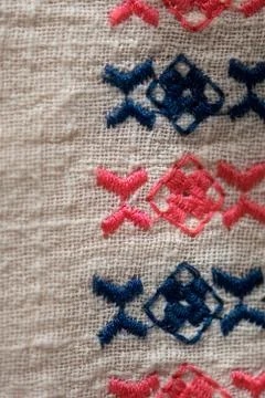 Embroidered pattern on cotton fabric . Stock Photos