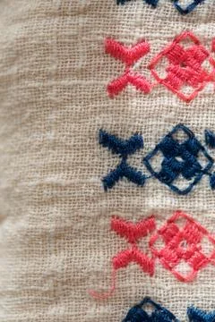 Embroidered pattern on cotton fabric . Stock Photos