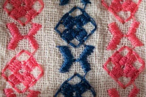Embroidered pattern on cotton fabric . Stock Photos