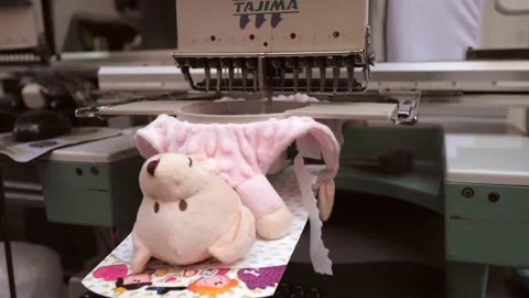 Embroidered teddy bears Stock Footage 169858490