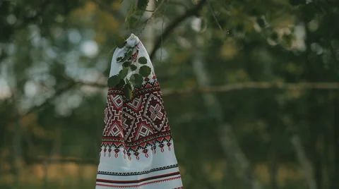Embroidered towels hanging on a tree branch Stock Footage 67987777