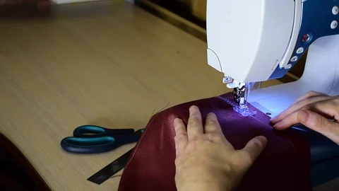 Embroidering patterns on a sewing machine machine Stock Footage 94459210