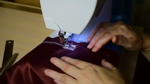 Embroidering patterns on a sewing machine machine Stock Footage 94460924