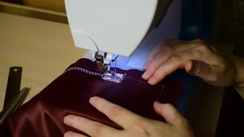 Embroidering patterns on a sewing machine machine Stock Footage 94462486