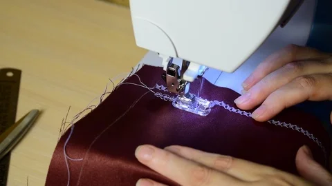 Embroidering patterns on a sewing machine machine Stock Footage 94731244