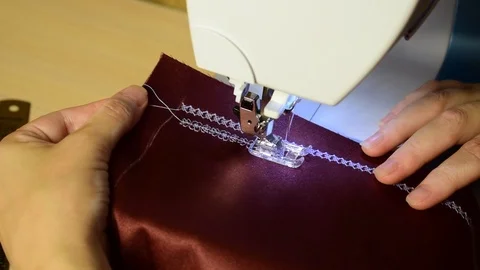 Embroidering patterns on a sewing machine machine Stock Footage 94731643