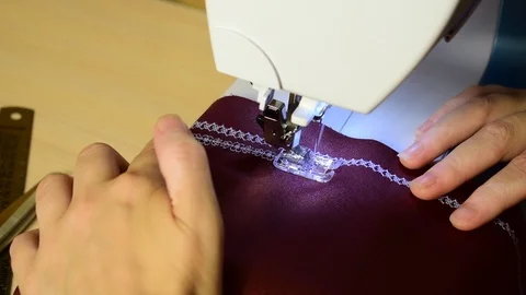 Embroidering patterns on a sewing machine machine Stock Footage 94732001