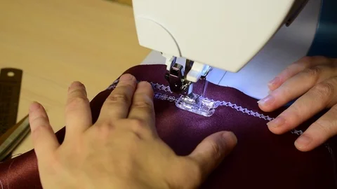 Embroidering patterns on a sewing machine machine Stock Footage 94732323