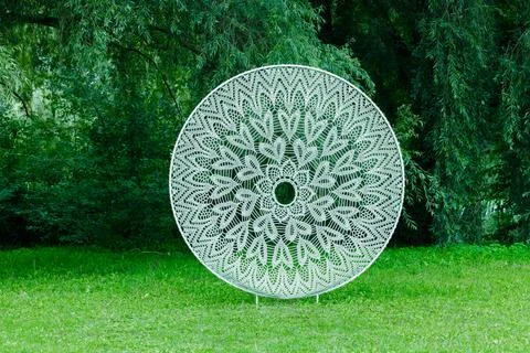 Embroidery circle pattern frame white threads net on summer green grass law.. 写真素材
