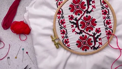 Embroidery with colored threads and various sewing accessories Stock Footage 263413856