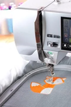 Embroidery with embroidery machine - fox theme - portrait orienataion, view o Stock Photos
