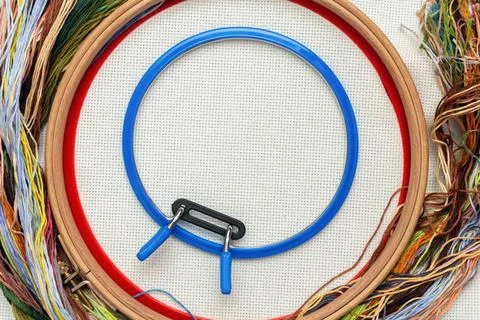 Embroidery frames, embroidery stitching kit with color threads and canvas bac Stock Photos