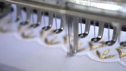 Embroidery machine creating textile patterns on cloth d Stock Footage 139093269