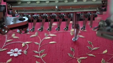 Embroidery machine creating textile patterns on cloth f Stock Footage 139093287