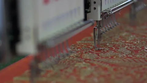 Embroidery machine creating textile patterns on cloth b Stock Footage 139093303