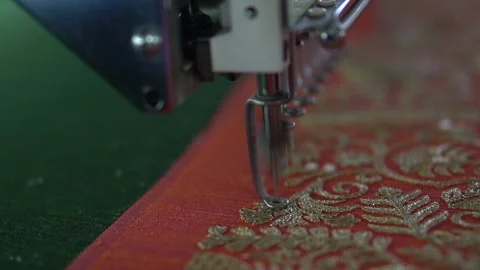 Embroidery machine creating textile patterns on cloth c Stock Footage 139093366