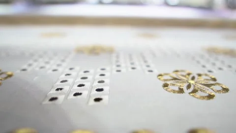 Embroidery machine creating textile patterns on cloth Stock Footage 139093394