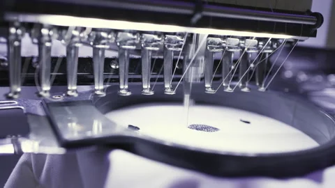 An embroidery machine producing stitched patterns with precision and Stock Footage 277665776