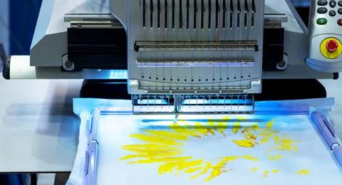 Embroidery machine stitching a logo Stock Photos