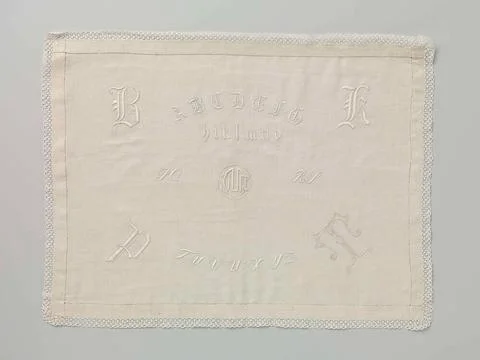 Embroidery patch of linen. Embroidery patch of white yarn on linen. The em... Stock Photos