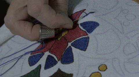 Embroidery by pattern. Embroidering with needle and thread, extreme close up. Stock Footage 57652947