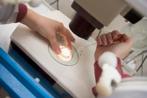 Embryologist adding sperm to egg Stock Photos