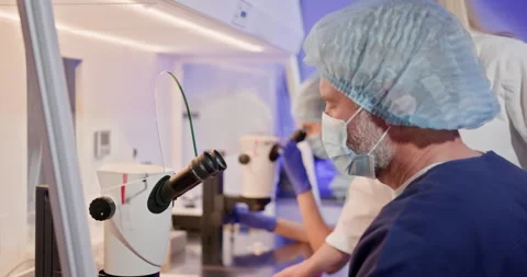 Embryologist Conducting Artificial Fertilization in Modern Laboratory Stock Footage 276427168