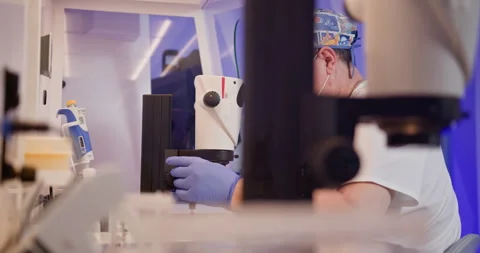 Embryologist Performing Artificial Fertilization in Laboratory Stock Footage 276411496