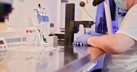 Embryologist Performing Artificial Fertilization in Laboratory Stock Footage 276414556