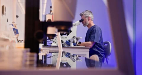 Embryologist Performing Artificial Fertilization in Laboratory Stock Footage 276418709
