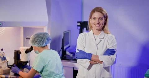 Embryologist Performing Artificial Fertilization in Laboratory Setting Stock Footage 276429473