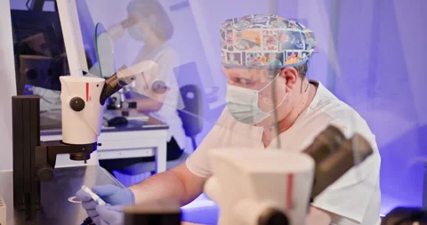 Embryologist Performing IVF Procedure in Laboratory Setting Stock Footage 276414744