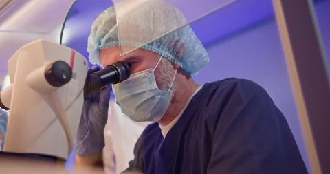 Embryologist Performs Artificial Fertilization in Laboratory Stock Footage 276428095