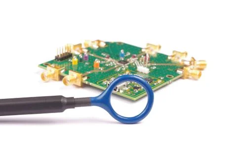 EMC engineer analyzing PCB using near-field probe Stock Photos