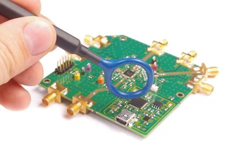 EMC engineer analyzing PCB using near-field probe Stock Photos