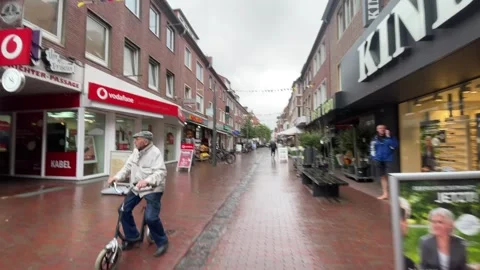 Emden, Germany - August 25, 2026: Central Emden street with cyclists, pedestrian Stock Footage 344391545