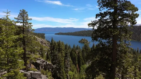 Emerald Bay - straight flight through the trees Stock Footage 114488034