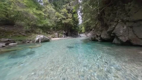 Emerald Blue Atera River with Crystal Clear Water in Nagano, Japan – FPV Drone Video stock 332162520