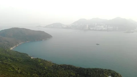 The emerald-colored sea separates the island of Lamma and Hong Kong. Stock Footage 119616931