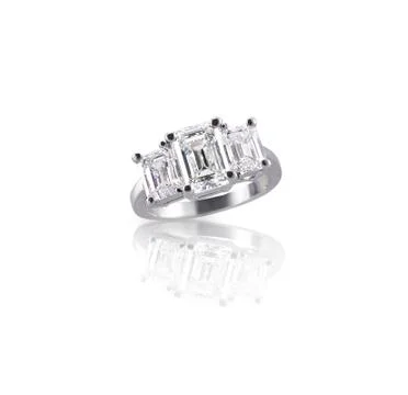 Emerald cut three stone trinity diamond engagement wedding ring Stock Photos