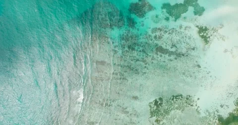 Emerald green ocean with shallow reef patterns. Seychelles, Mahe. Stock Footage 343333826