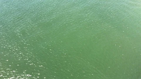 Emerald green rippled water surface Stock Footage 94584829